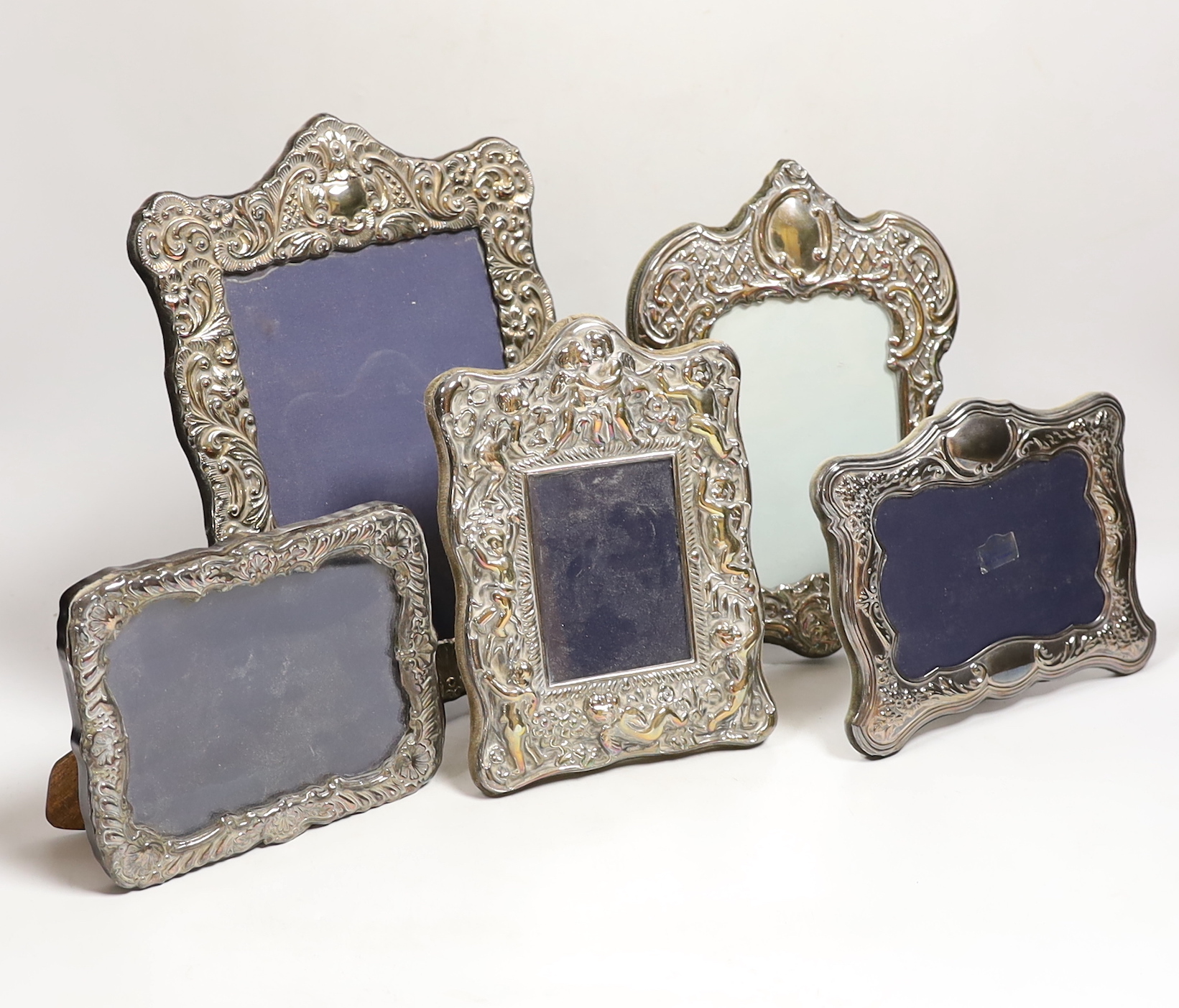 Five assorted modern silver mounted photograph frames, largest 27.5cm.